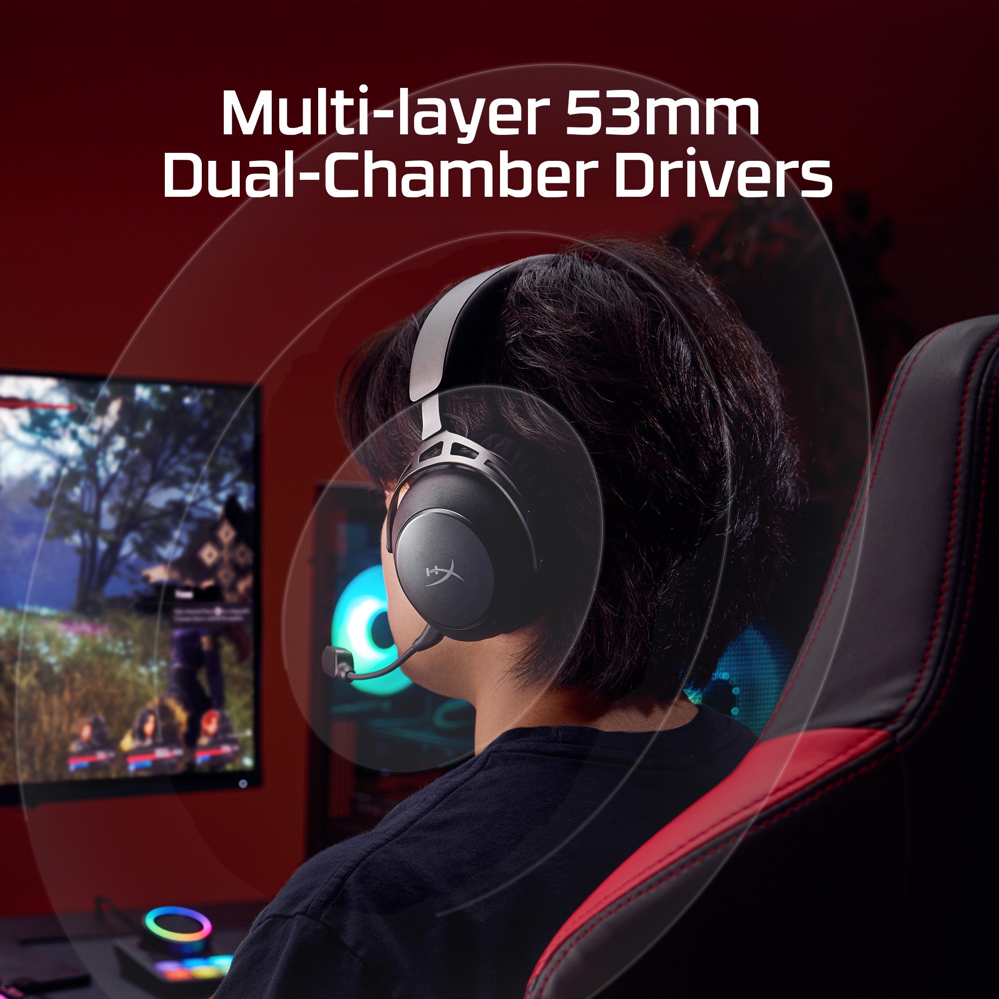 Person wearing a gaming headset with text about multi-layer 53mm dual-chamber drivers, sitting in front of a computer screen.